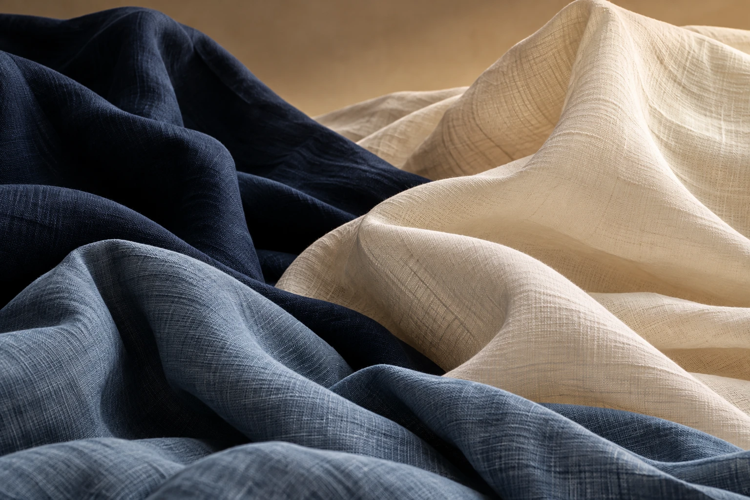 Sculptural folds of cream, navy and slate textiles